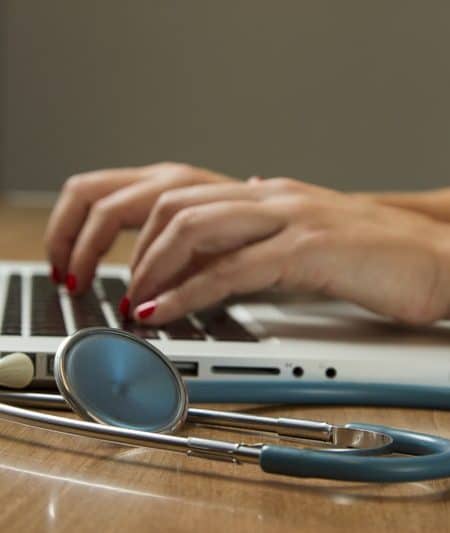 Person typing on laptop